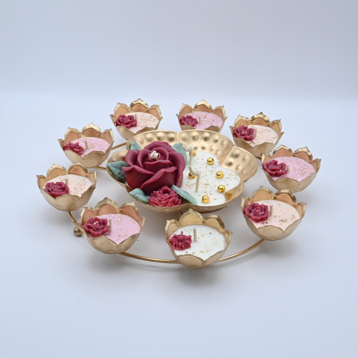 Left view of the Red Rose Rose Garden Metal Urli Candle Arrangement with lotus-shaped metal candle cups and red floral wax details.