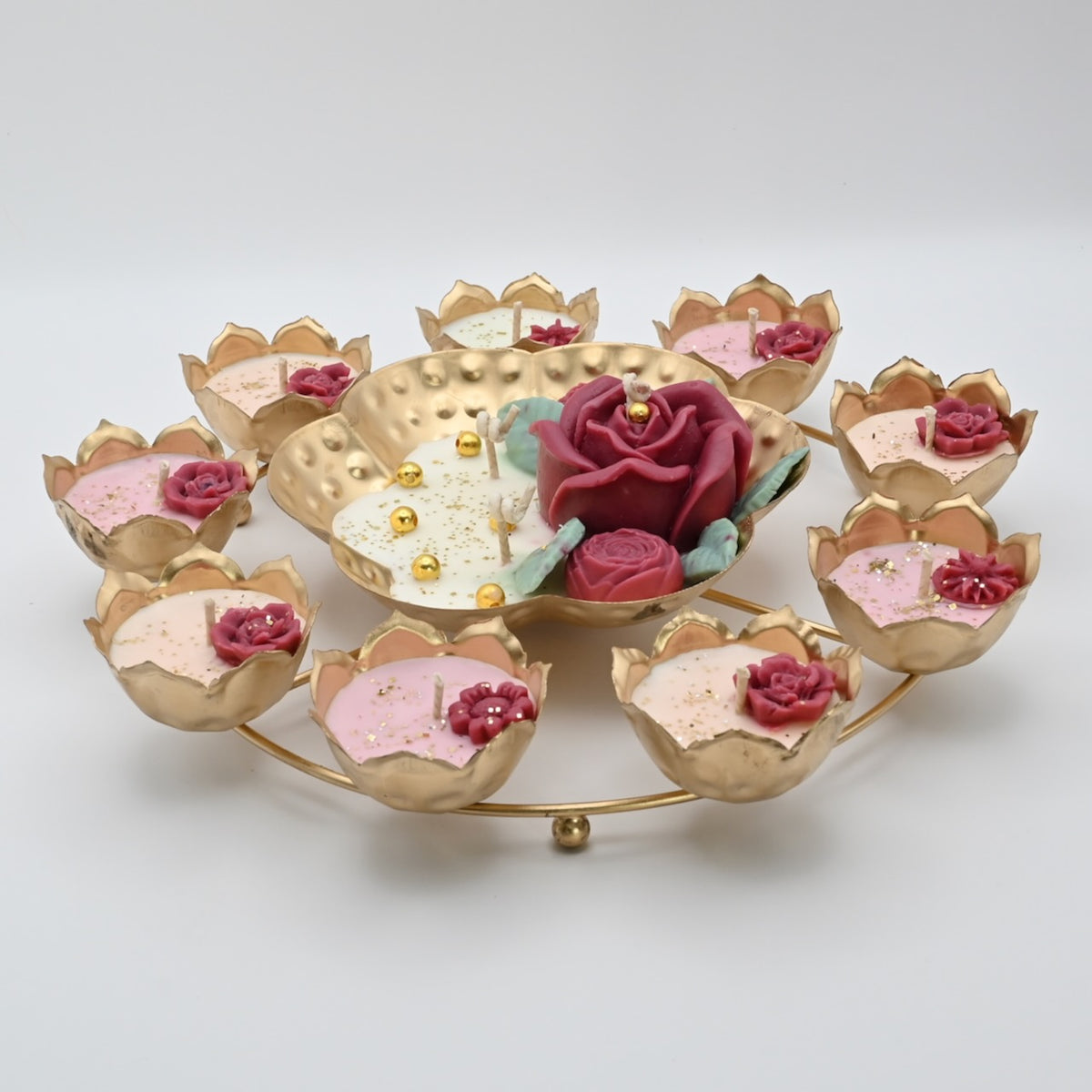 Right view of the Red Rose Rose Garden Metal Urli Candle Arrangement with a raised floral centerpiece and surrounding candle cups.