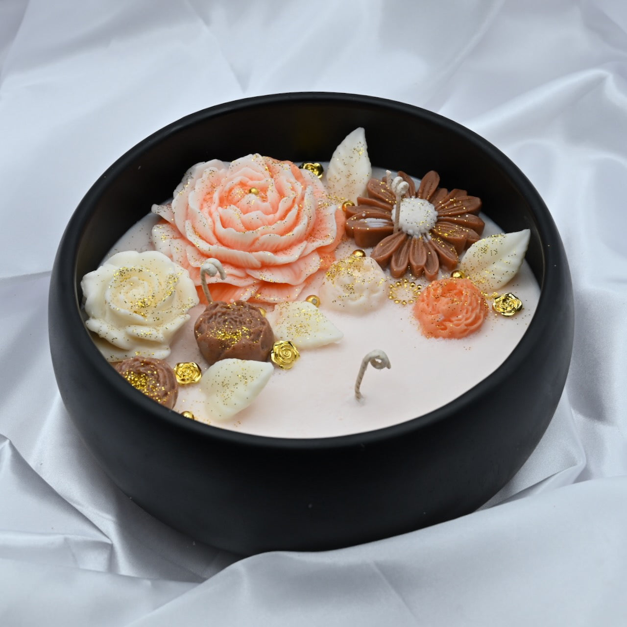 Detail view of midnight blue acacia wood bowl candle with handcrafted floral wax design, medium 8 inch decorative soy candle