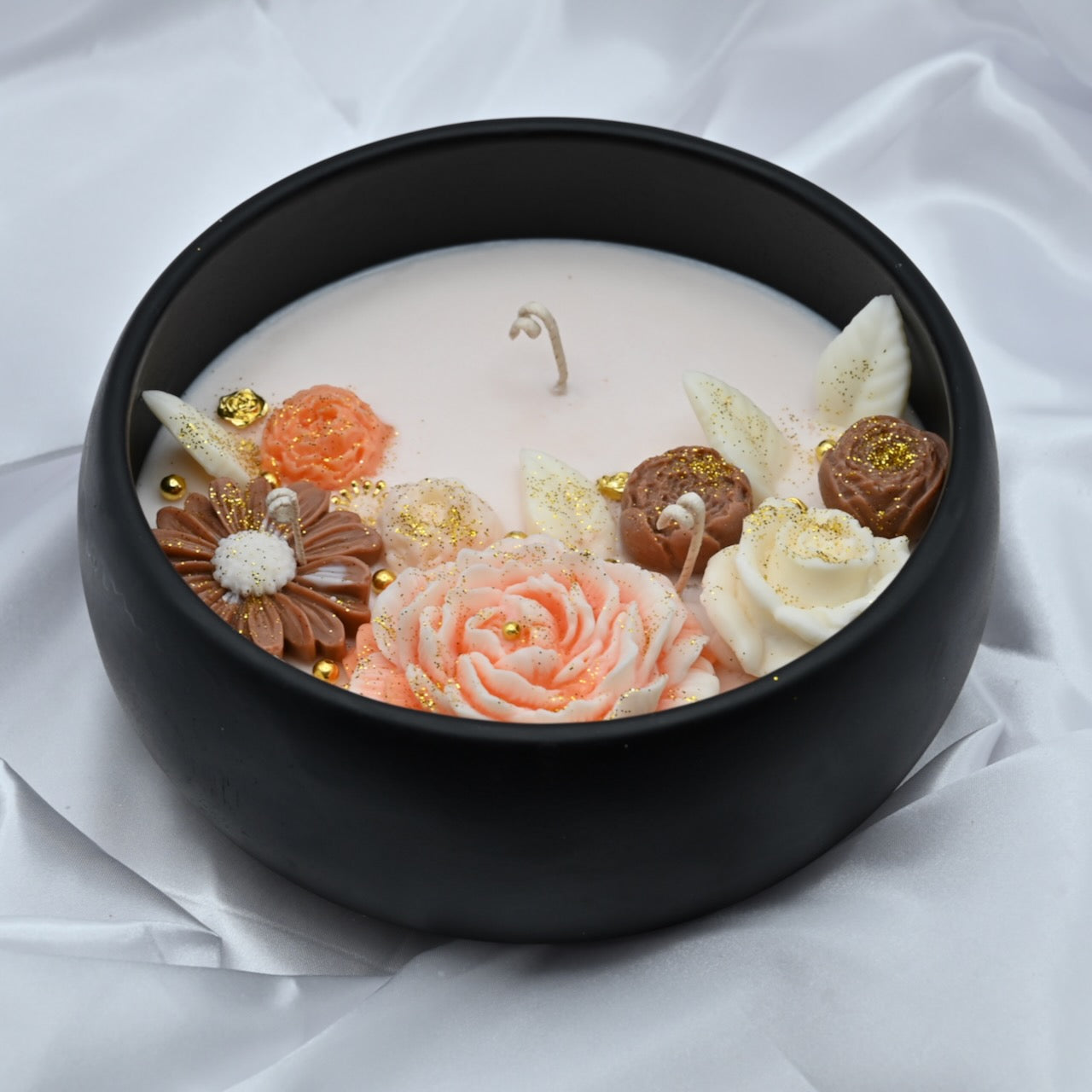 Down view of midnight blue acacia wood bowl candle with handcrafted floral wax design, medium 8 inch decorative soy candle