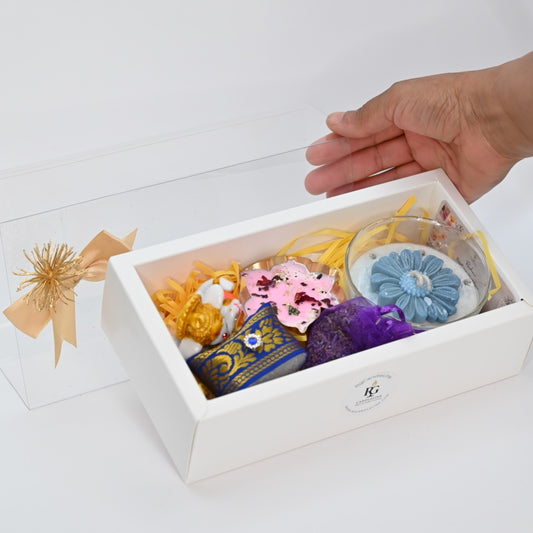 Large white gift box cover displayed in hand for candle gift hamper