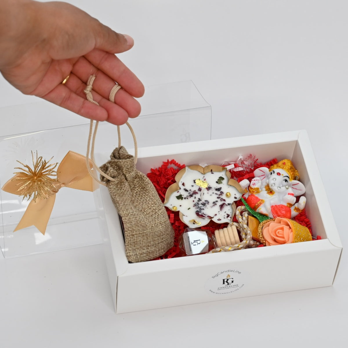 Medium gift box with small bag displayed in hand