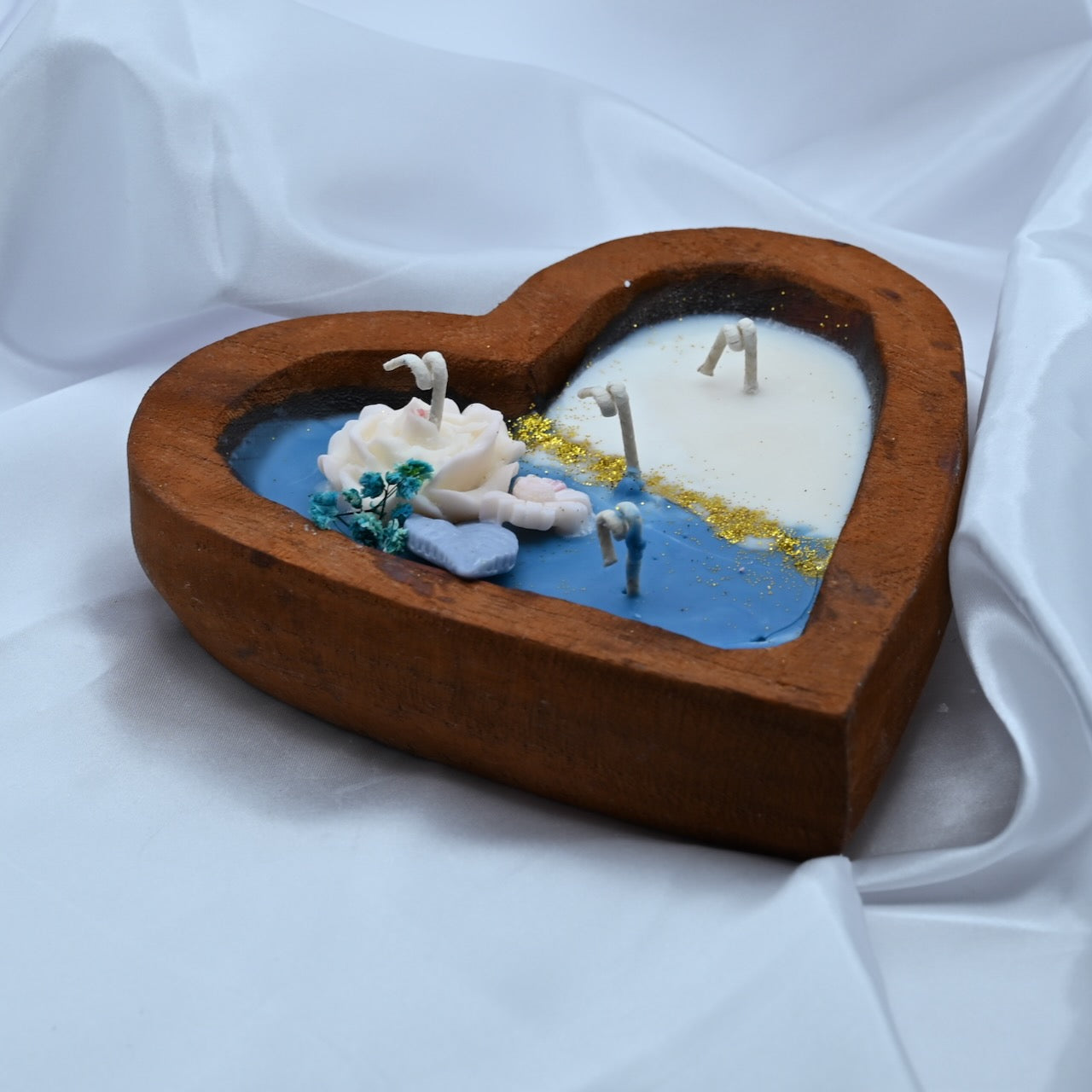 Heart shaped wooden box with a decorative candle