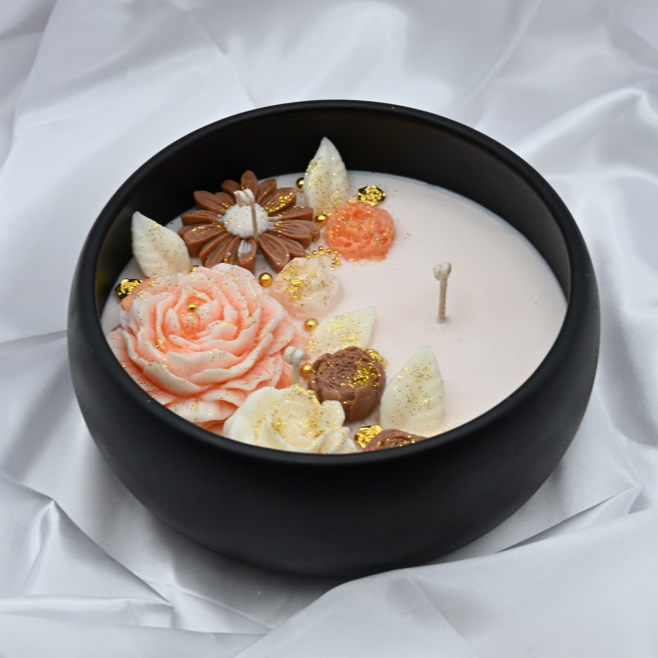 Left view of midnight blue acacia wood bowl candle with handcrafted floral wax design, medium 8 inch decorative soy candle