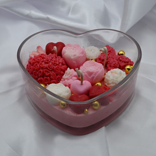 Hand-poured  rose soy candle in heart-shaped glass container from RG Candleline.